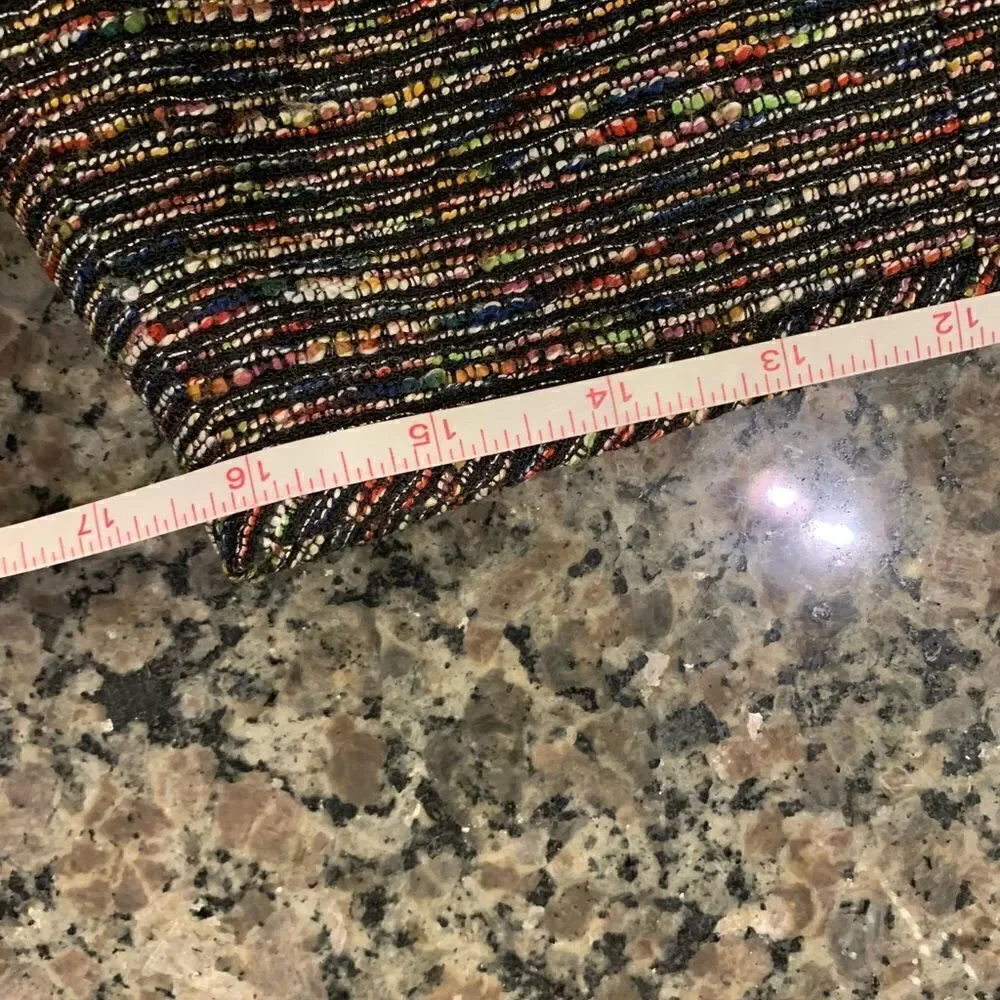 Tahari pencil skirt.  Size: 12. Small slit on back. Metallic thread throughout.